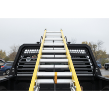 Weather Guard Louvered Headache Rack 11904-52-01 carrying a ladder